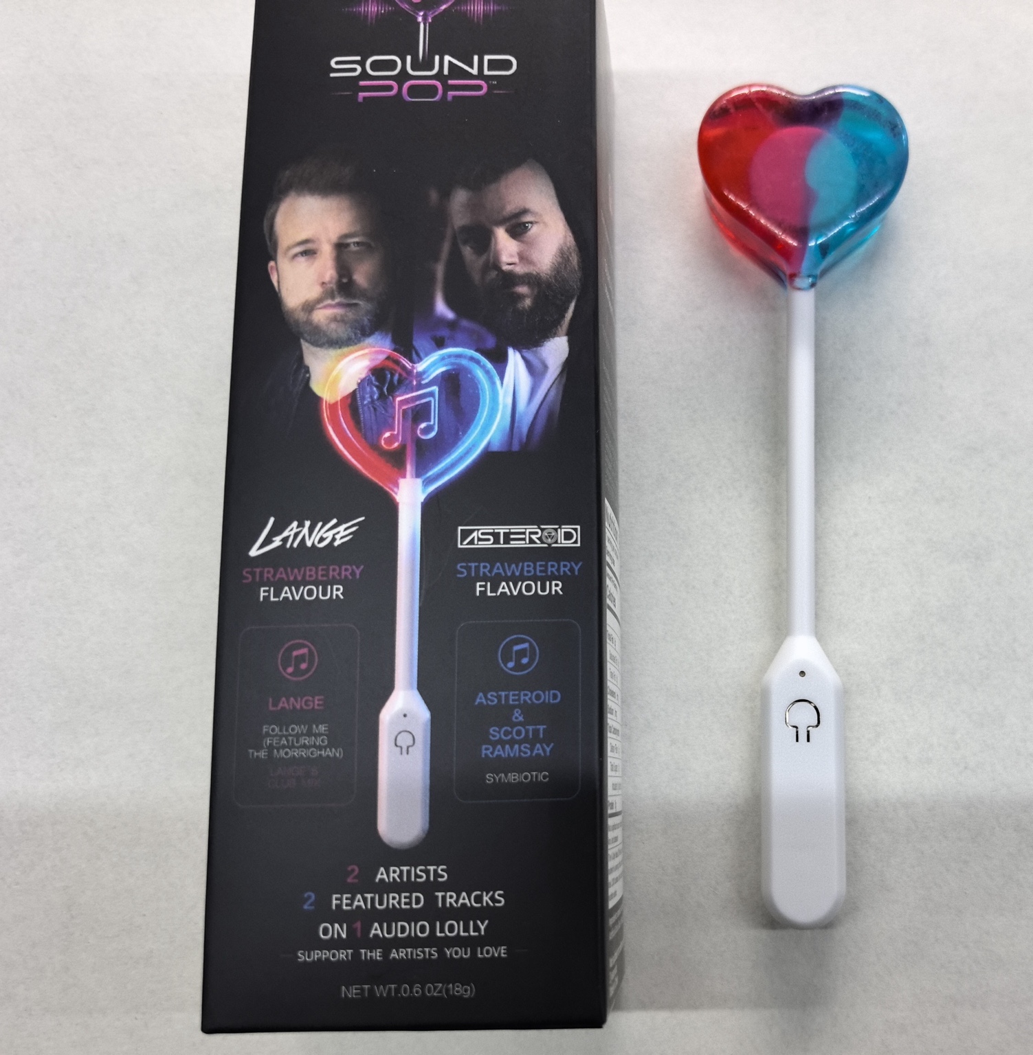Sound Pop individual lolly retail box beside the real red-and-blue heart-shaped audio lolly